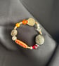 Handmade earth coloured bracelet, 16cm, reds, gold, orange beadwork 