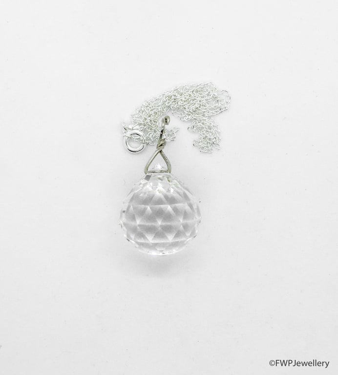 Antique facetted crystal ball, silver fitting and chain