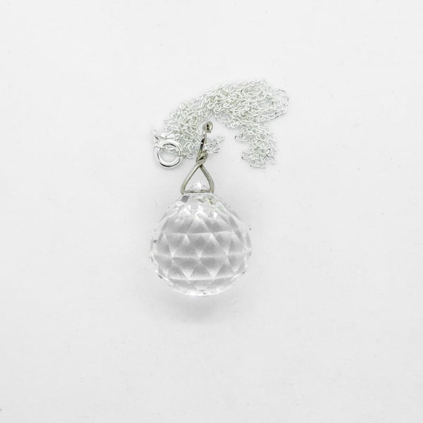 Antique facetted crystal ball, silver fitting and chain