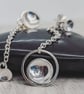 Domed Silver Mismatched Earrings - Image 7