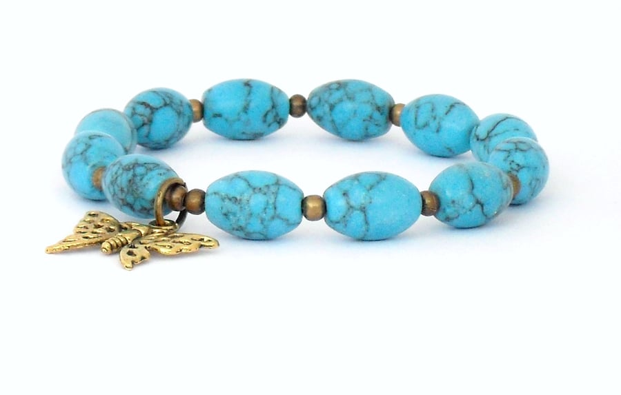 Blue turquoise bracelet with antique gold butterfly charm