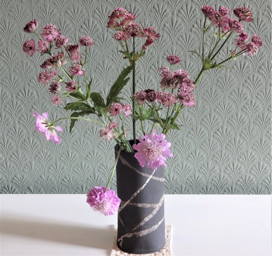 Sian. Black ceramic flower or foliage vase, swirl ribbons design.