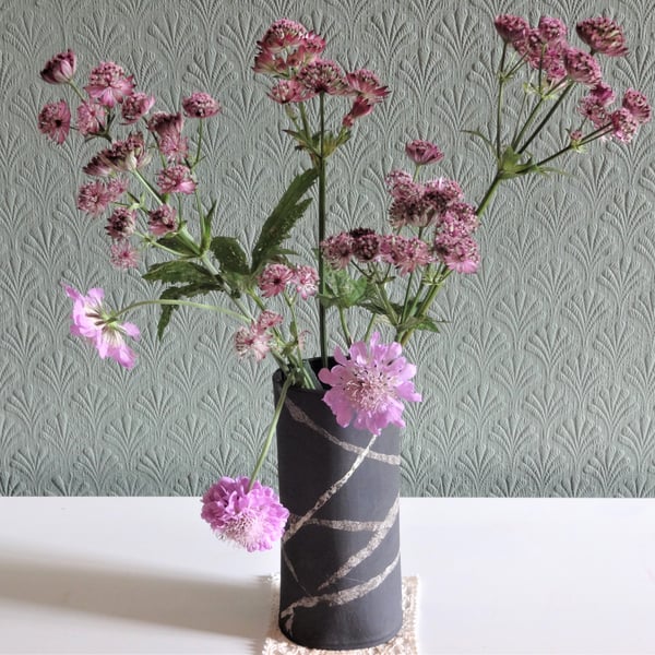 Sian. Black ceramic flower or foliage vase, swirl ribbons design.