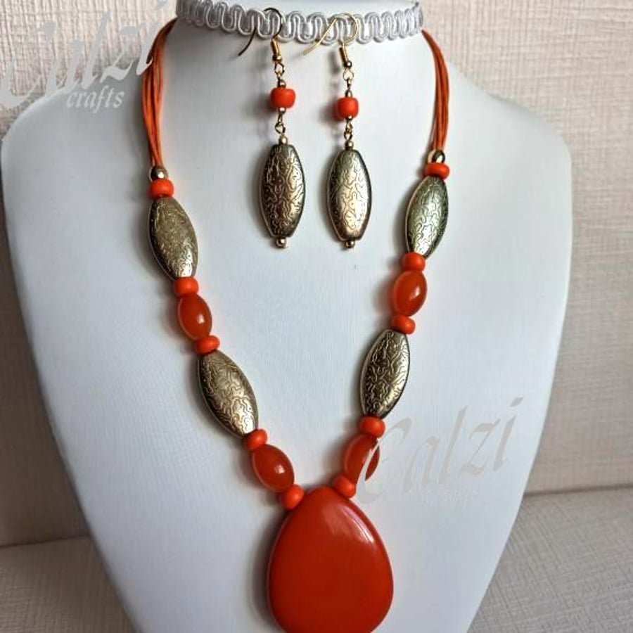 Image of Orange And Gold Pendant Necklace And Matching Earrings