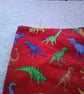 Brightly Coloured Dinosaurs on Red Dribble Bib - Image 3