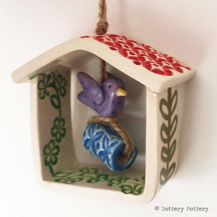 Small decorative pottery birdhouse hanging decoration with ceramic bird and bead