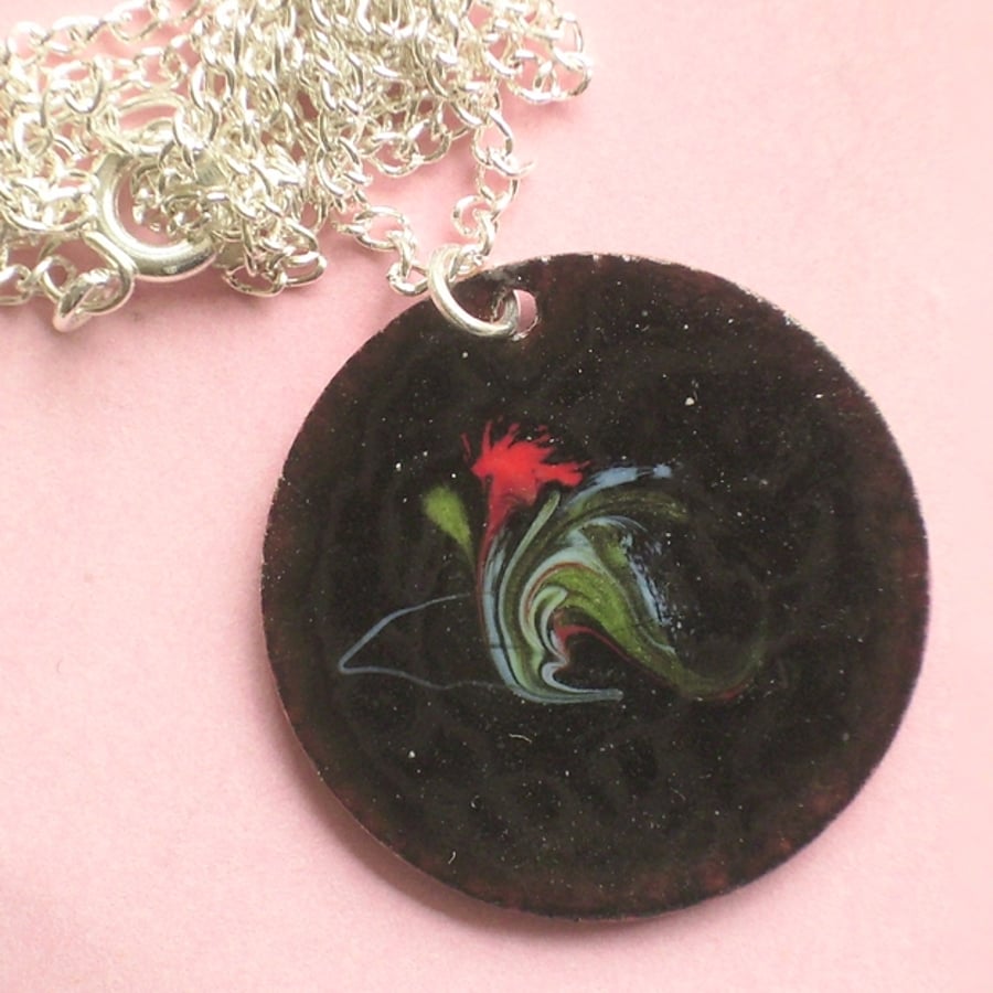 round pendant - scrolled red, white, green over black