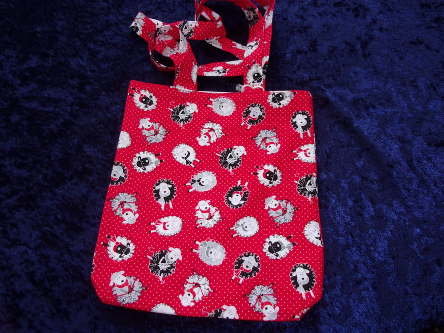 Red Spotted Fabric Bag with Black & White Sheep