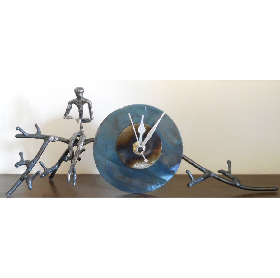 branch mantle clock with figure reading