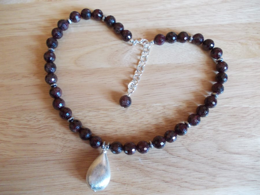 Garnet necklace with brushed silver plated copper teardrop pendant
