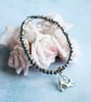 Stretching Yoga Cat Bracelet with Small Silver Glass Beads - Image 1
