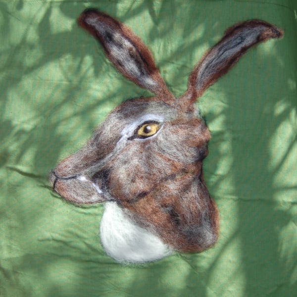 Green tote bag embellished with a needle felted hare portrait