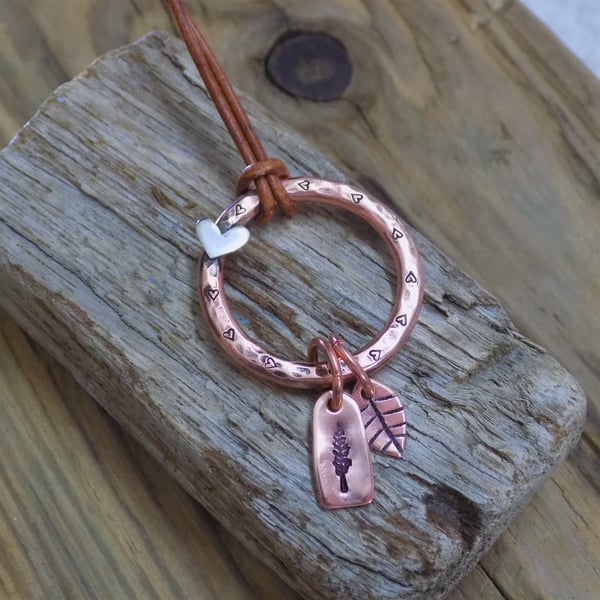 Rustic copper hoop pendant with heart and charms 