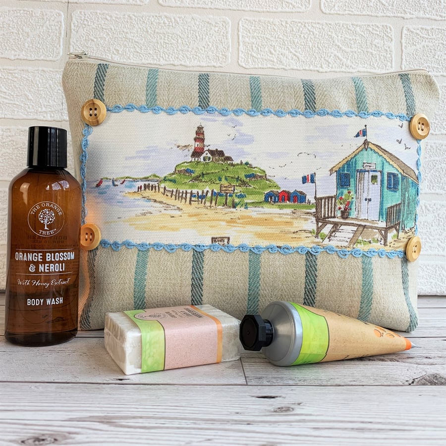 Toiletry bag with beach huts and lighthouse coastal decorative panel