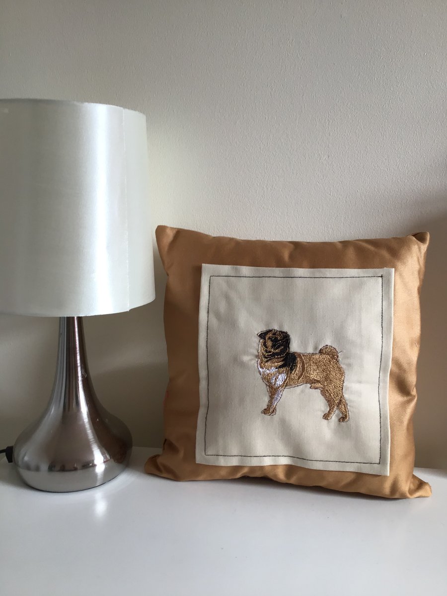 Pug embroidered cushion.