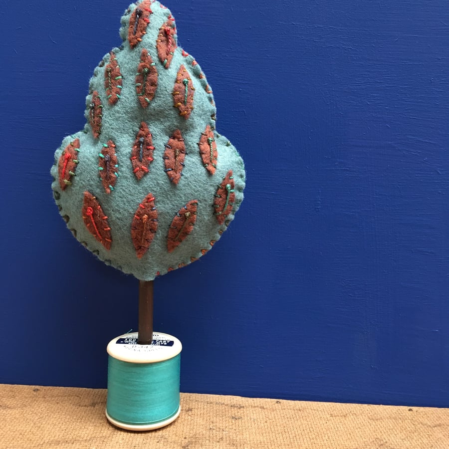 Cotton reel tree - teal with brown leaves
