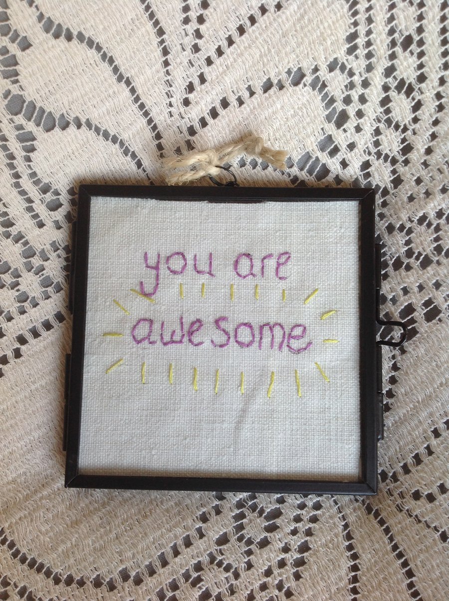 Glass frame with embroidered quote