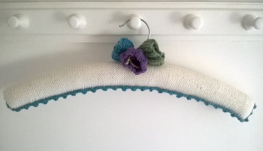 Handmade ladies Cream coat hanger with knitted crocus