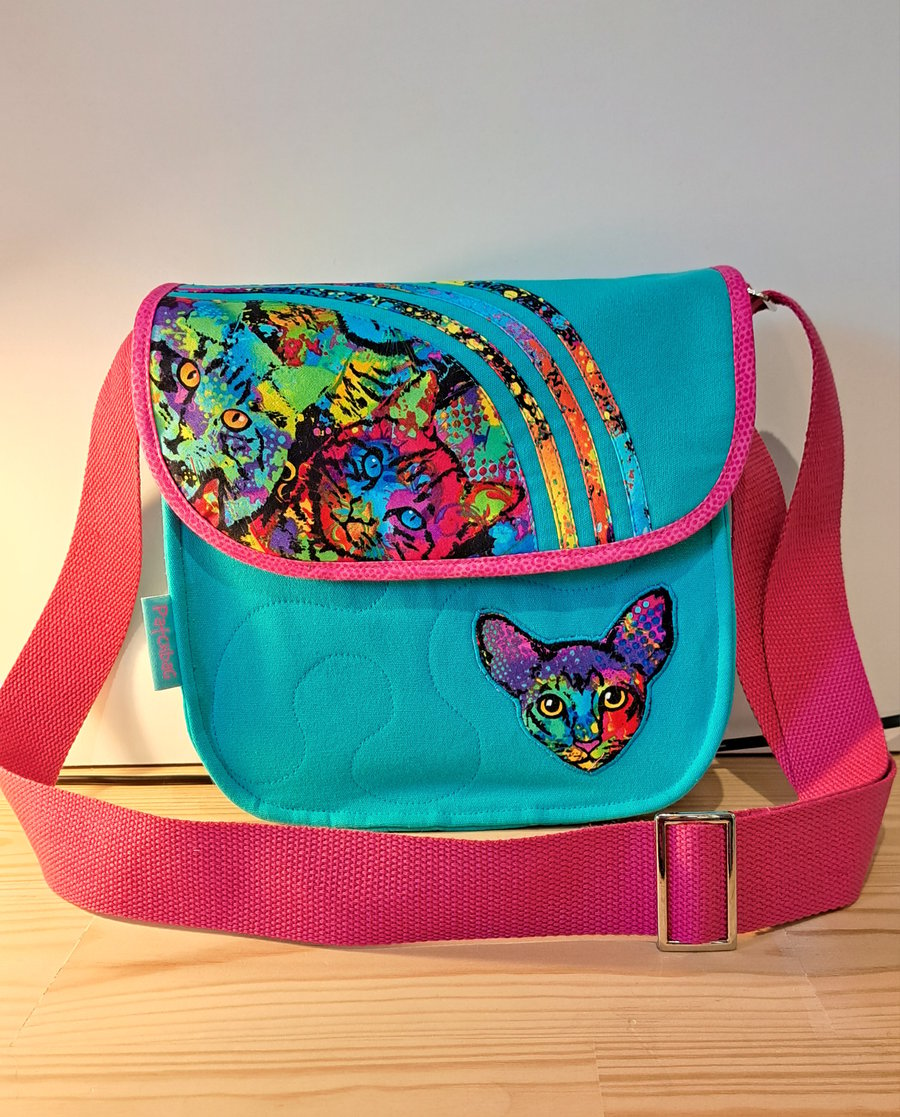  Small turquoise handbag with colorful cats