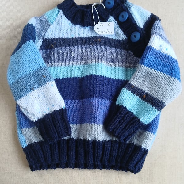 Handknitted  baby's blue striped jumper.  0 to 3 mths. All proceeds to charity.c