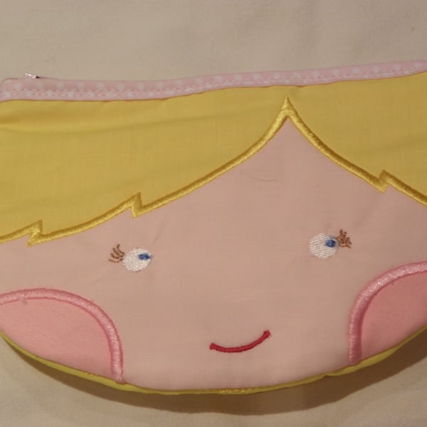 Face shaped purse.