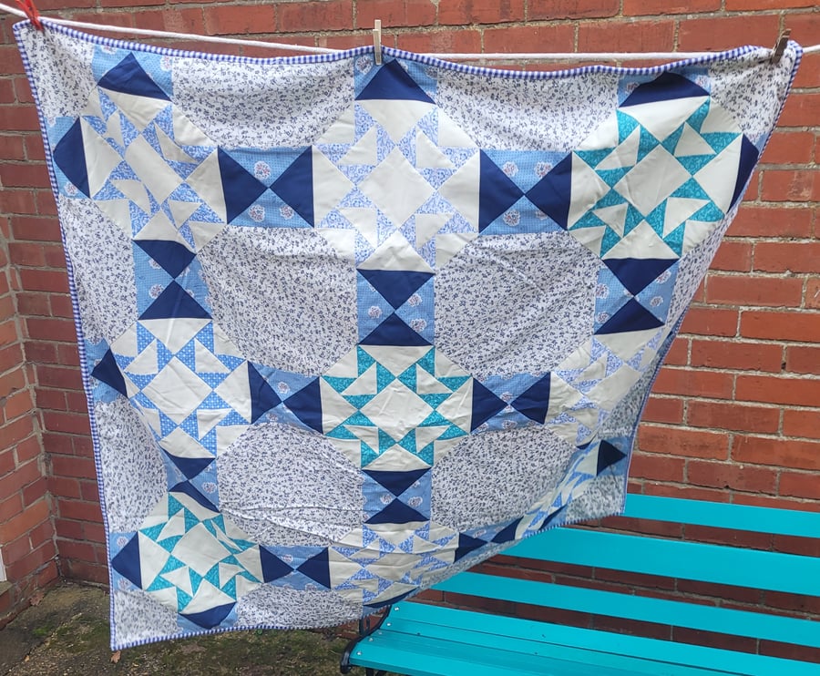 Blue and white patchwork quilt. 100% cotton fabric front and back.(30)