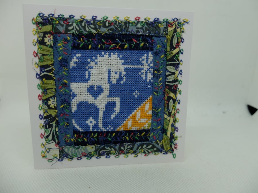 Unicorn cross stitch embroidered card in log cabin quilt block surround