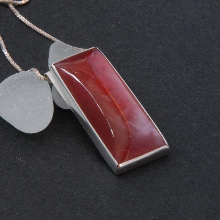 Sterling silver and strawberry red bowlerite pendant