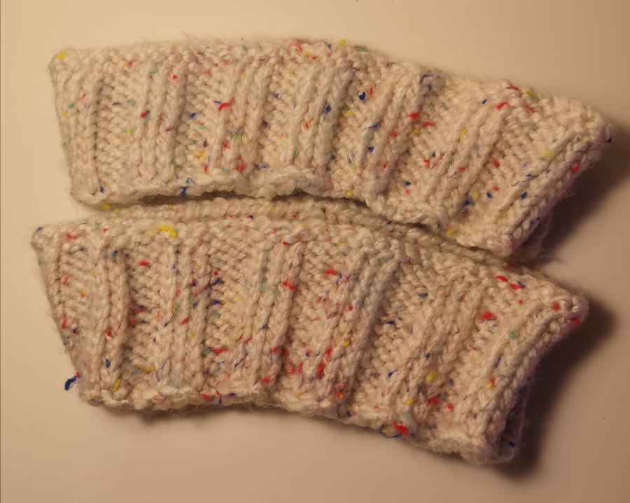 Handknitted oatmeal rainbow flecked ribbed ear warmer
