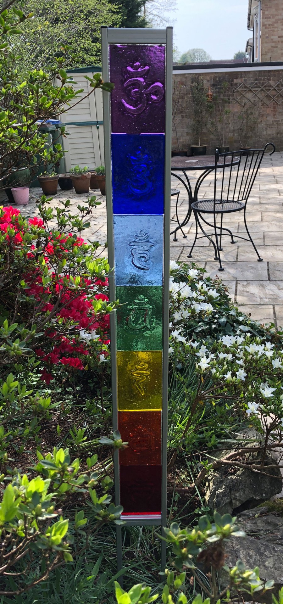 Chakra design glass garden sculpture panel in aluminium frame