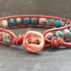 Red and blue rainbow jasper and leather bracelet with ceramic button fastener