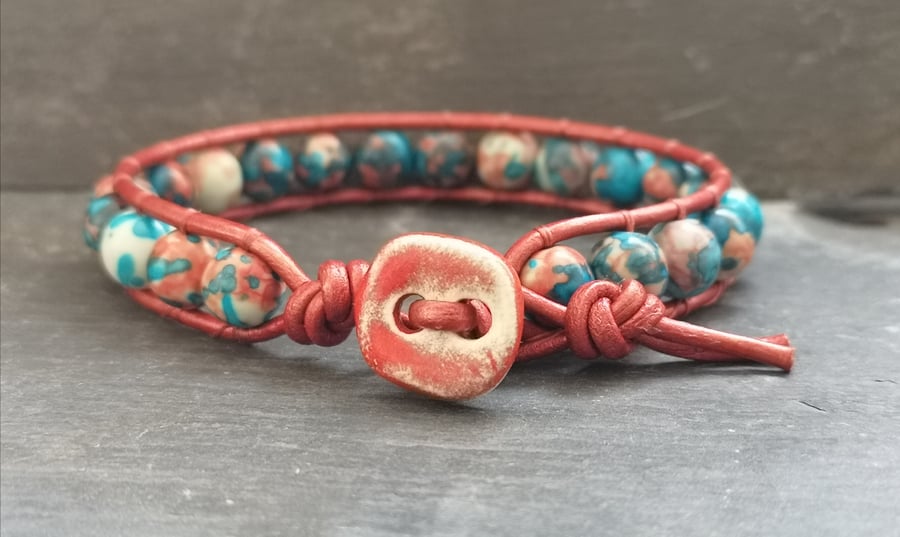 Red and blue rainbow jasper and leather bracelet with ceramic button fastener