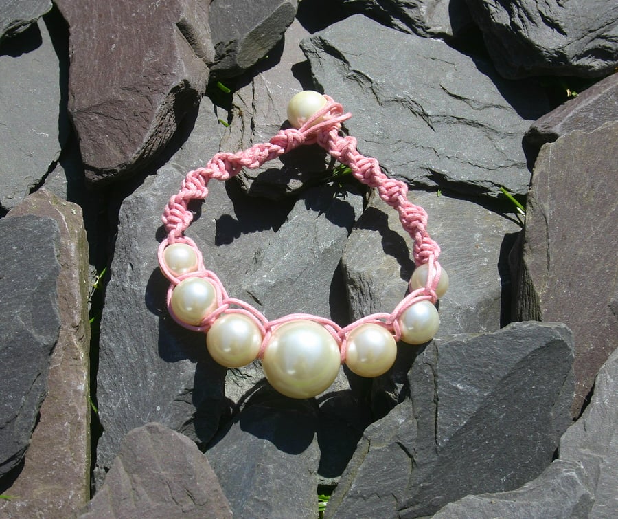 Pink and cream boho chic braided friendship bracelet with acrylic beads