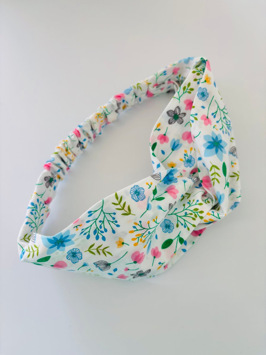 Cotton headband, twist knot style hairband in a white, pink & blue floral design