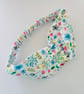 Cotton headband, twist knot style hairband in a white, pink & blue floral design - Image 1