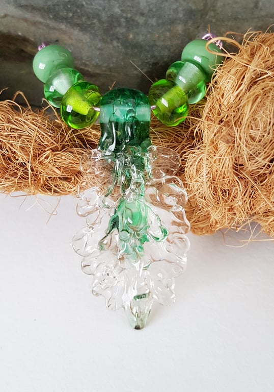 Lampwork glass pendant bead set in green UK hand crafted