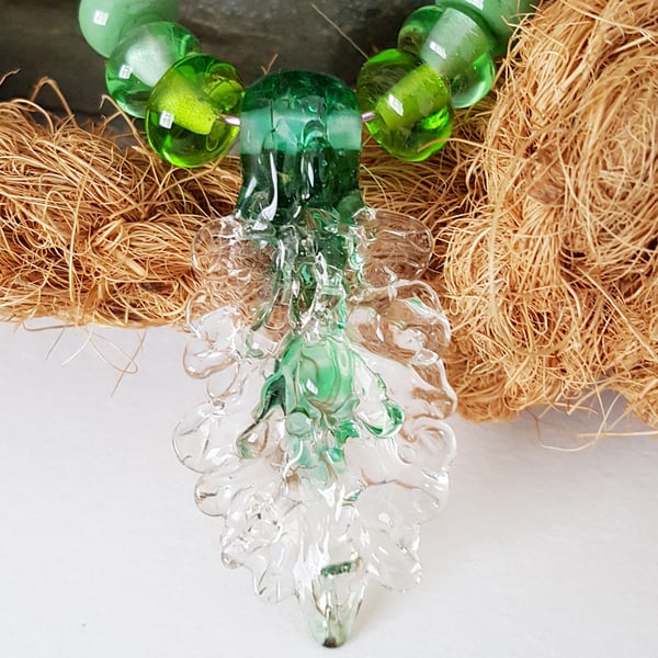 Lampwork glass pendant bead set in green UK hand crafted