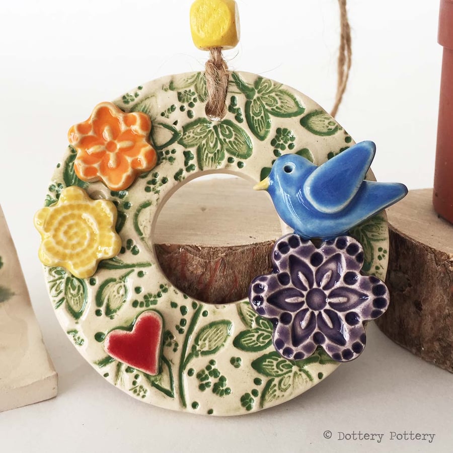 Small ceramic floral wreath decoration with bird and flowers pottery bird 