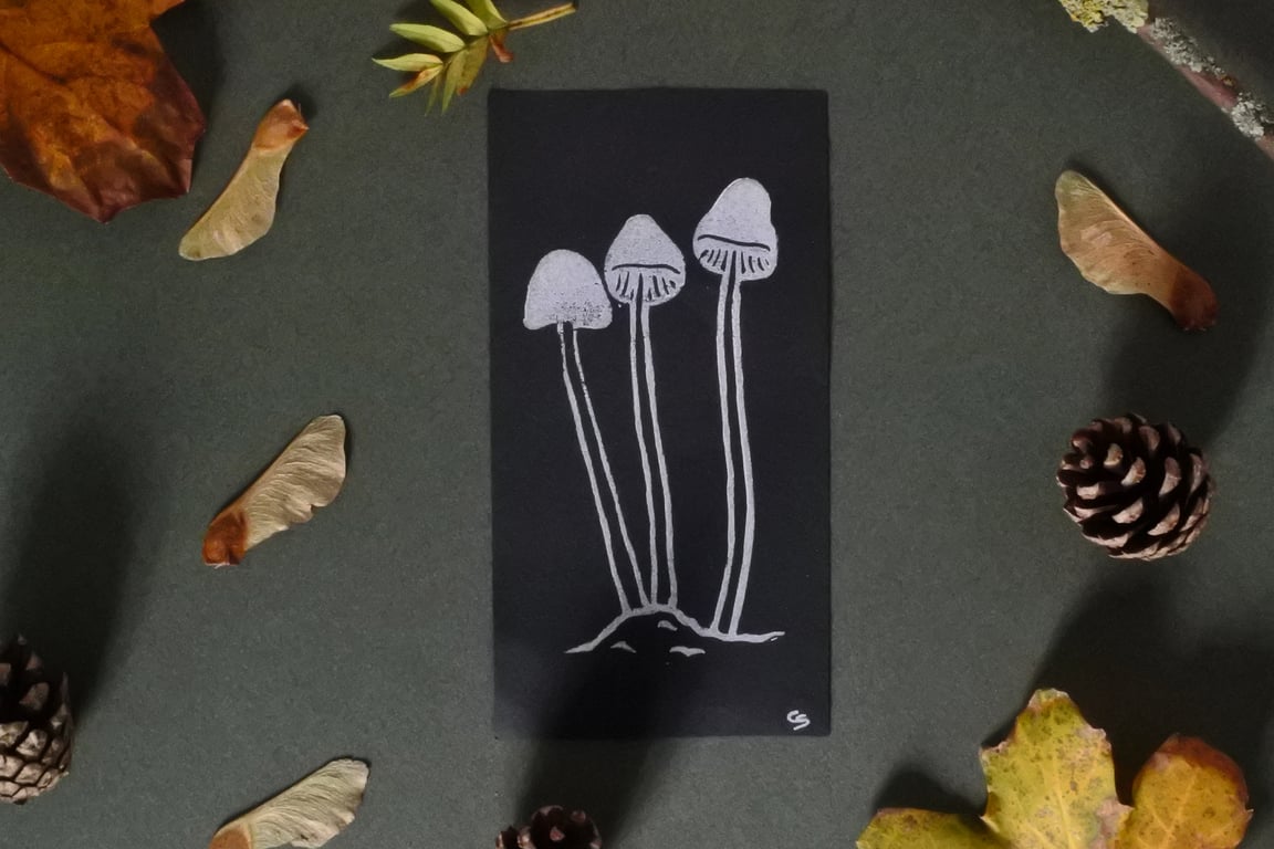 White Mushrooms – Small handmade lino print on black paper