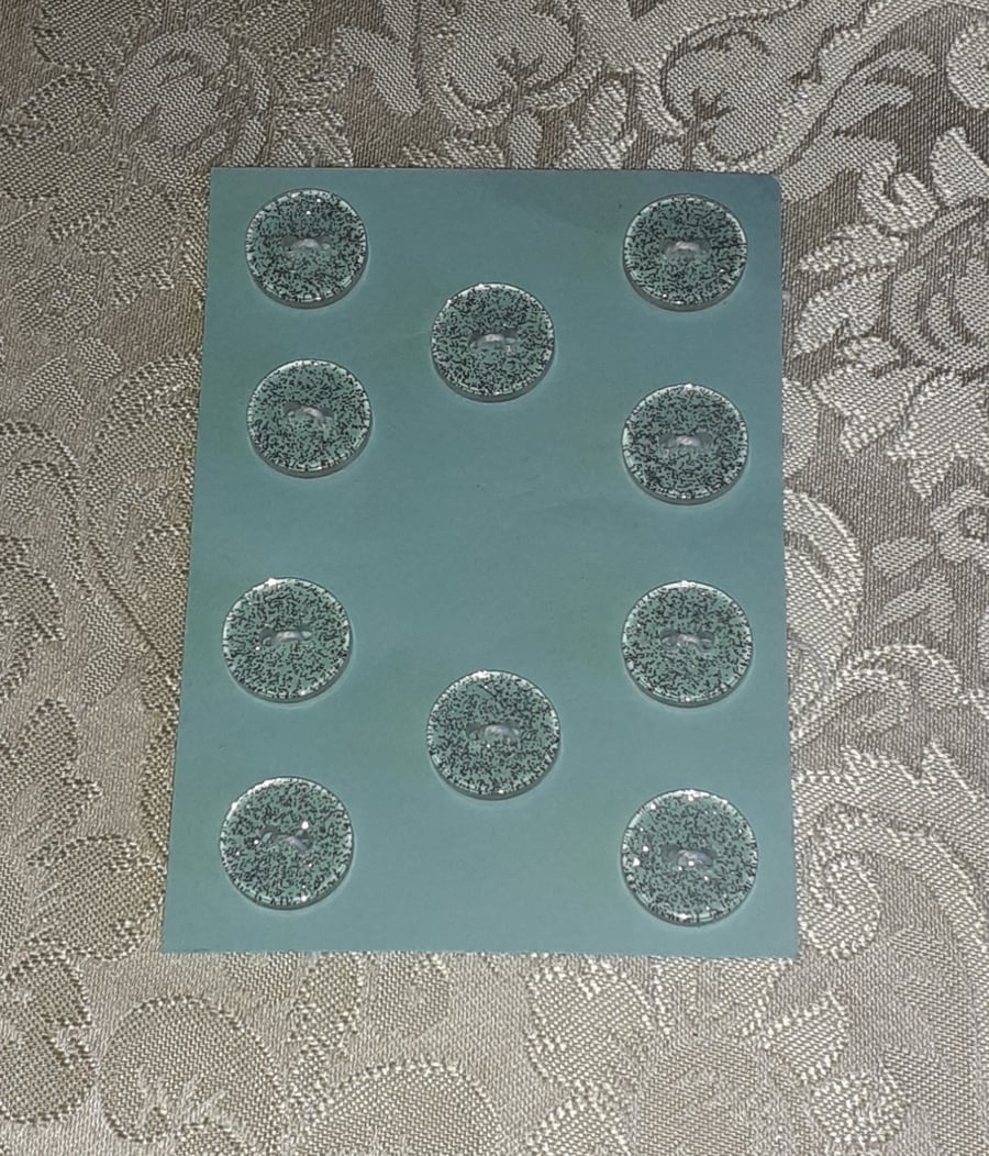 CLEAR BUTTONS WITH SILVER GLITTER IN THEM