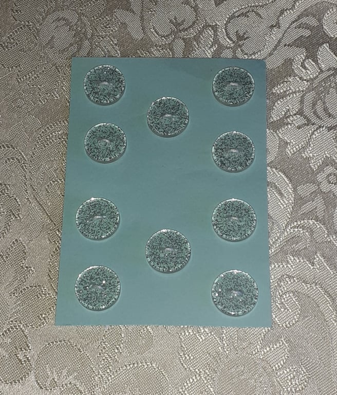 CLEAR BUTTONS WITH SILVER GLITTER IN THEM