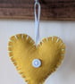 Handmade handstitched felt heart - yellow with white stitching - Image 1