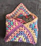 Granny square crocheted book cover or Kindle cover. 