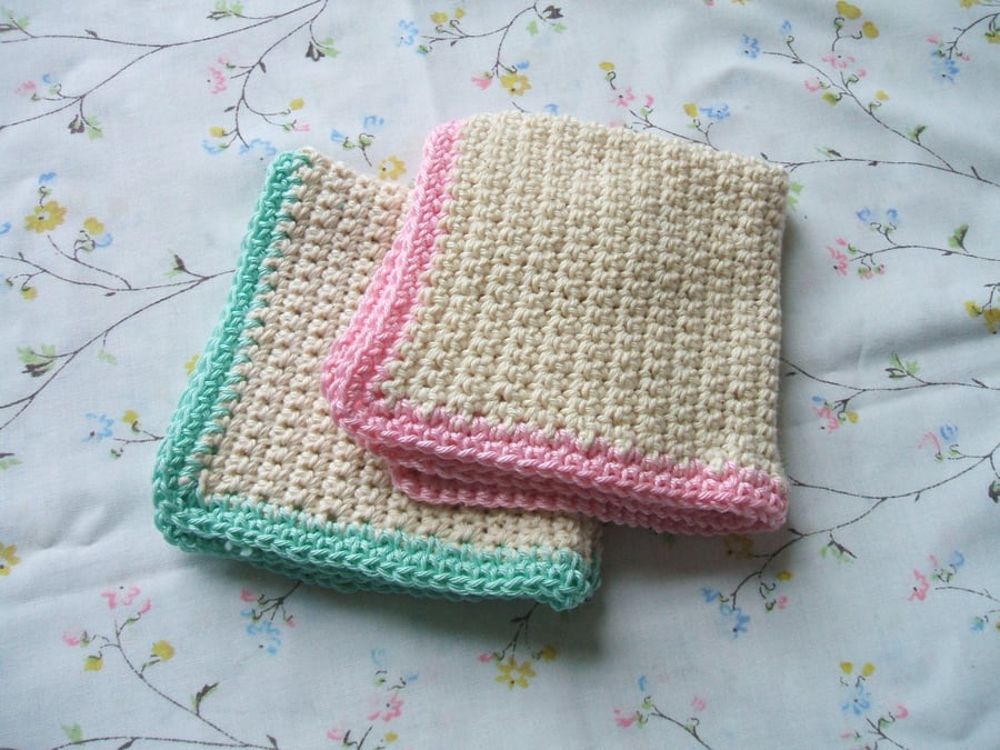 2 crocheted face cloths - cream, pink, mint green
