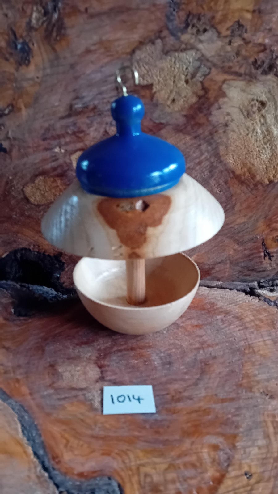 Bird feed with blue top. 