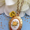 Locket with porcelain  floral metal cabochon