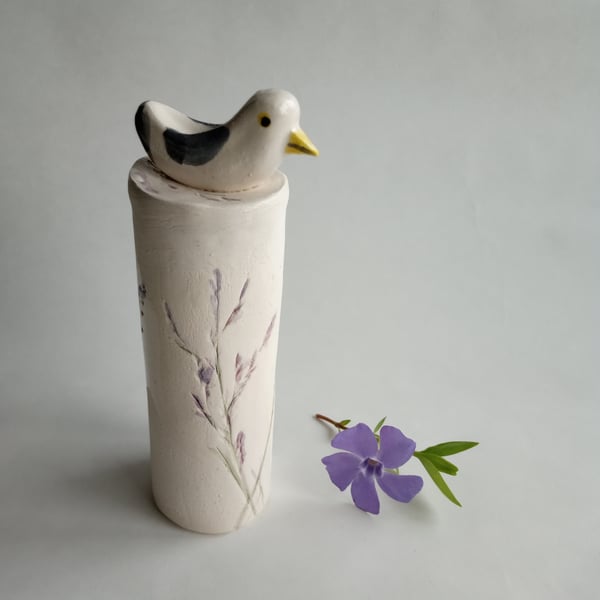 ceramic seagull on a floral plinth