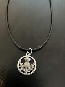 scottish thistle charm pendant on a 18" leather cord necklace