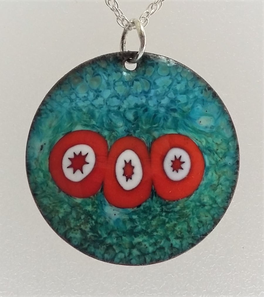 'Opposites attract’ millefiori pendant in enamelled copper 123