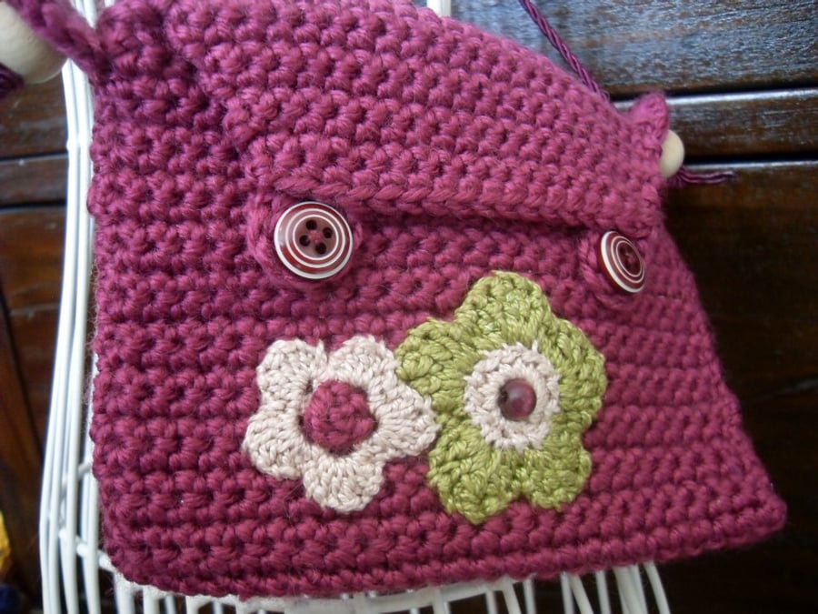 Small Satchel Bag, in plum pink with applique crochet flowers and button detail.